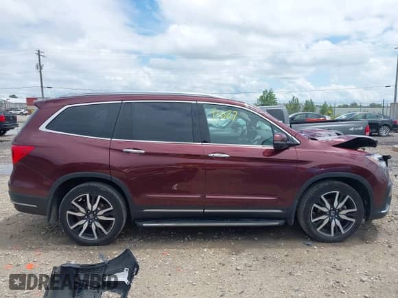 2022 Honda Pilot Elite z VIN 5FNYF6H0XNB072311, wystawiony jako IAAI lot #42591027 z przebiegiem 43 873 mil mil oraz . Historia ofert i sprzedaży dostępna na DreamBid. Obrazek 13.