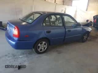 2000 Hyundai Accent with VIN KMHCG45G6YU066218, listed as a Copart auction lot 84948715 with 110,059 mi miles and Salvage title. Bid and sale history available at DreamBid. Image 3.
