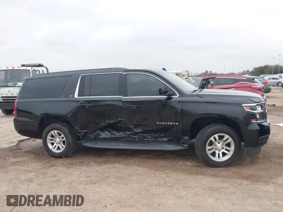 2018 Chevrolet Suburban LT with VIN 1GNSCHKC4JR130955, listed as a IAAI auction lot 41619186 with 74,564 mi miles and . Bid and sale history available at DreamBid. Image 13.