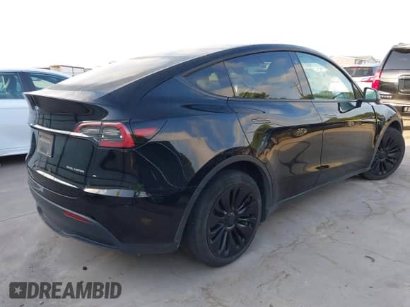 2023 Tesla Model Y Long Range z VIN 7SAYGAEE7PF767951, wystawiony jako IAAI lot #43128878 z przebiegiem 36 431 mil mil oraz . Historia ofert i sprzedaży dostępna na DreamBid. Obrazek 4.