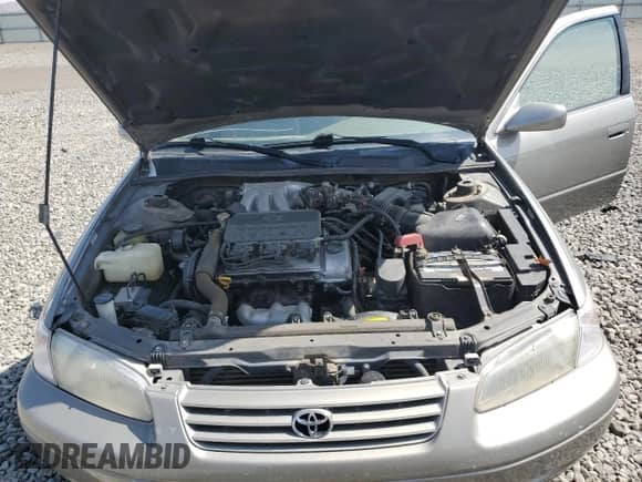 1997 Toyota Camry LE z VIN JT2BF22K4V0018017, wystawiony jako Copart lot #71291145 z przebiegiem 131 770 mil mil oraz Szkoda całkowita • Salvage title. Historia ofert i sprzedaży dostępna na DreamBid. Obrazek 11.