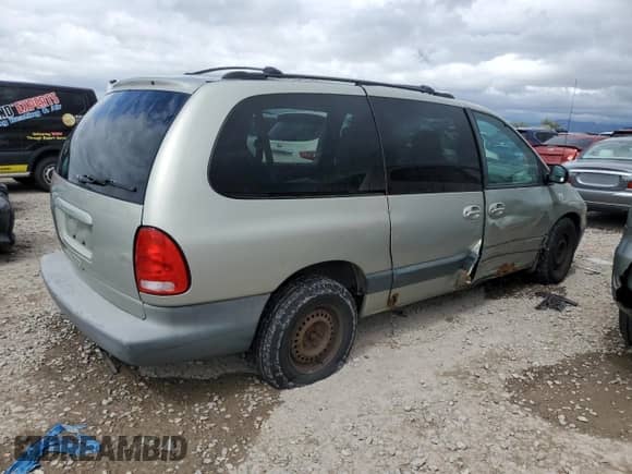 1999 Dodge Caravan SE with VIN 1B4GT44L0XB893221, listed as a Copart auction lot 56673125 with 242,497 mi miles and Salvage title. Bid and sale history available at DreamBid. Image 3.