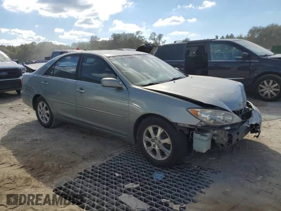 2005 Toyota Camry LE с VIN 4T1BF32KX5U596821, выставлен на аукционе Copart как лот 87047295 с пробегом 169 634 миль миль и Списание • Salvage title. История ставок и продаж доступна на DreamBid. Изображение 4.