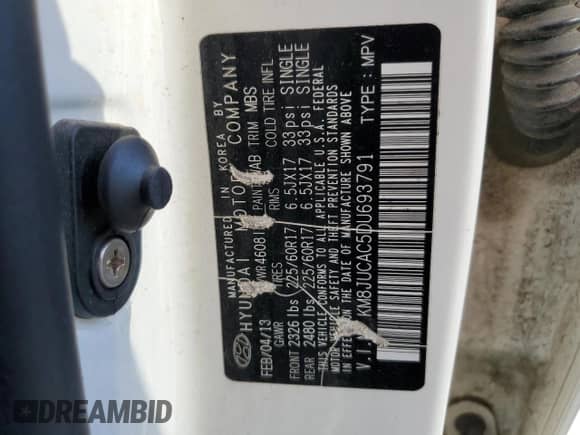 2013 Hyundai Tucson GLS with VIN KM8JUCAC5DU693791, listed as a Copart auction lot 82000975 with 148,470 mi miles and Salvage title. Bid and sale history available at DreamBid. Image 13.