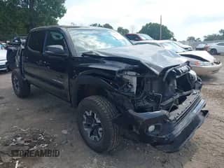 2021 Toyota Tacoma SR z VIN 5TFCZ5AN3MX268371, wystawiony jako IAAI lot #43235555 z przebiegiem 51 763 mil mil oraz . Historia ofert i sprzedaży dostępna na DreamBid. Obrazek 1.