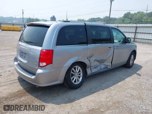 2020 Dodge Grand Caravan SXT with VIN 2C4RDGCGXLR160961, listed as a IAAI auction lot 42891500 with 125,048 mi miles and . Bid and sale history available at DreamBid. Image 4.