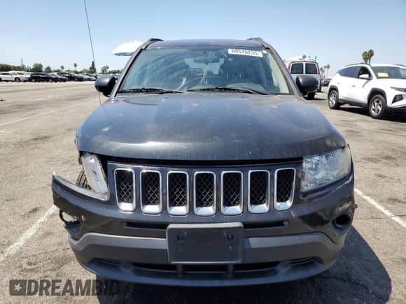 2011 Jeep Compass with VIN 1J4NT1FA0BD137755, listed as a Copart auction lot 69515235 with 108,023 mi miles and Salvage title. Bid and sale history available at DreamBid. Image 5.