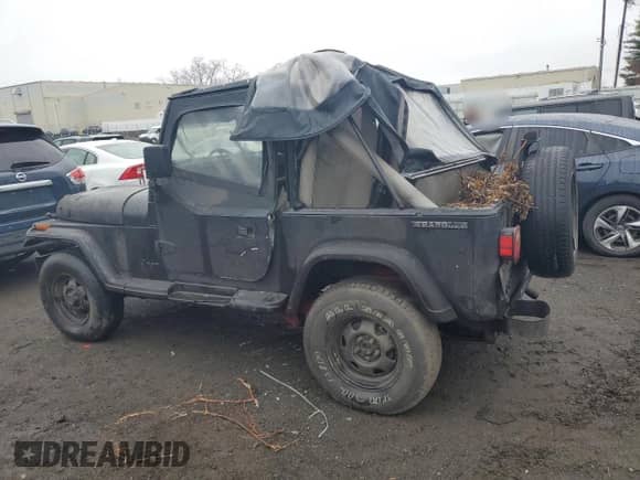 1989 Jeep Wrangler z VIN 1J4FY29T8KJ149494, wystawiony jako Copart lot #51719895 z przebiegiem Nie podano mil oraz Nie do naprawy • Non repairable. Historia ofert i sprzedaży dostępna na DreamBid. Obrazek 2.