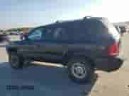 1999 Dodge Durango z VIN 1B4HS28Z4XF521562, wystawiony jako Copart lot #76974074 z przebiegiem 202 296 mil mil oraz Szkoda całkowita • Salvage title. Historia ofert i sprzedaży dostępna na DreamBid. Obrazek 2.