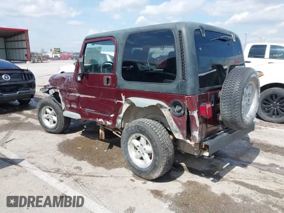 2001 Jeep Wrangler SE with VIN 1J4FA29P21P300094, listed as a IAAI auction lot 41871446 with 125,098 mi miles and . Bid and sale history available at DreamBid. Image 3.
