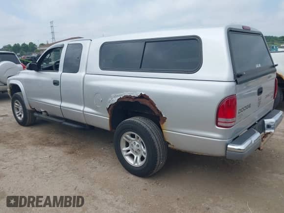 2003 Dodge Dakota SLT с VIN 1D7HG42N53S168603, выставлен на аукционе IAAI как лот 42670088 с пробегом 128 763 миль миль и . История ставок и продаж доступна на DreamBid. Изображение 3.