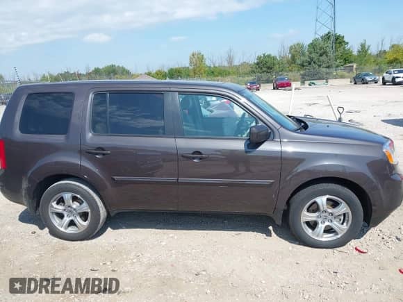 2013 Honda Pilot EX-L with VIN 5FNYF4H57DB082731, listed as a IAAI auction lot 43203205 with 96,017 mi miles and . Bid and sale history available at DreamBid. Image 13.