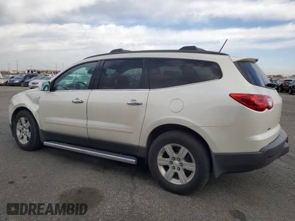 2012 Chevrolet Traverse 1LT z VIN 1GNKVGED0CJ276215, wystawiony jako Copart lot #86154995 z przebiegiem 159 498 mil mil oraz Szkoda całkowita • Salvage title. Historia ofert i sprzedaży dostępna na DreamBid. Obrazek 2.