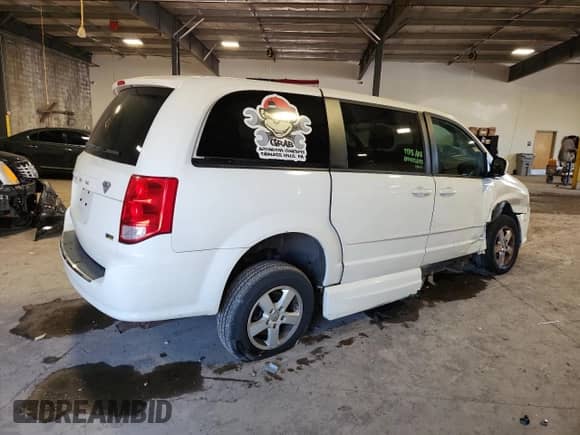2011 Dodge Grand Caravan Mainstreet with VIN 2D4RN3DG2BR626839, listed as a Copart auction lot 80804825 with 143,663 mi miles and Salvage title. Bid and sale history available at DreamBid. Image 3.