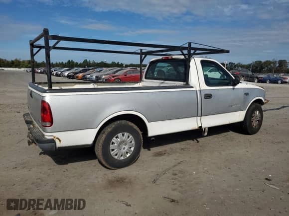 1997 Ford F-150 с VIN 1FTDF1727VNC20744, выставлен на аукционе Copart как лот 82264605 с пробегом 163 329 миль миль и Списание • Salvage title. История ставок и продаж доступна на DreamBid. Изображение 3.