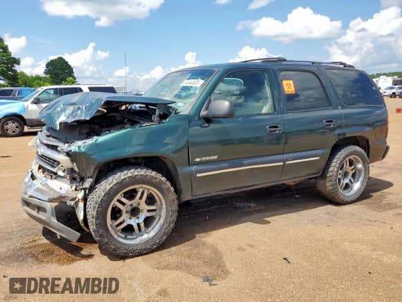 2001 Chevrolet Tahoe LT with VIN 1GNEC13T81R110727, listed as a Copart auction lot 64844605 with 218,238 mi miles and Salvage title. Bid and sale history available at DreamBid. Image 1.