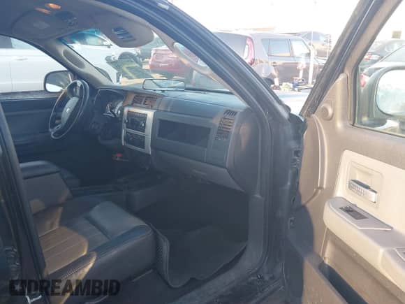 2008 Dodge Dakota Laramie with VIN 1D7HW58N18S593890, listed as a IAAI auction lot 41762135 with 109,669 mi miles and . Bid and sale history available at DreamBid. Image 5.