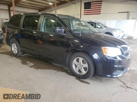 2011 Dodge Grand Caravan Mainstreet with VIN 2D4RN3DGXBR611800, listed as a Copart auction lot 84710005 with 190,362 mi miles and Salvage title. Bid and sale history available at DreamBid. Image 4.