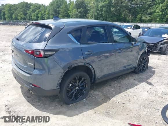 2023 Mazda CX-5 S Carbon Edition z VIN JM3KFBCM3P0262534, wystawiony jako IAAI lot #42740448 z przebiegiem 10 257 mil mil oraz . Historia ofert i sprzedaży dostępna na DreamBid. Obrazek 4.