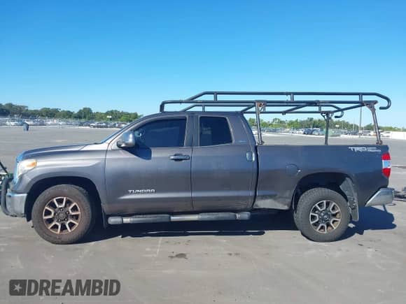 2014 Toyota Tundra SR z VIN 5TFRM5F10EX080231, wystawiony jako IAAI lot #43477473 z przebiegiem 202 585 mil mil oraz . Historia ofert i sprzedaży dostępna na DreamBid. Obrazek 14.