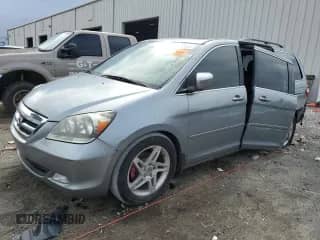 2005 Honda Odyssey Touring with VIN 5FNRL38855B015662, listed as a Copart auction lot 85138385 with 233,978 mi miles and Salvage title. Bid and sale history available at DreamBid. Image 1.