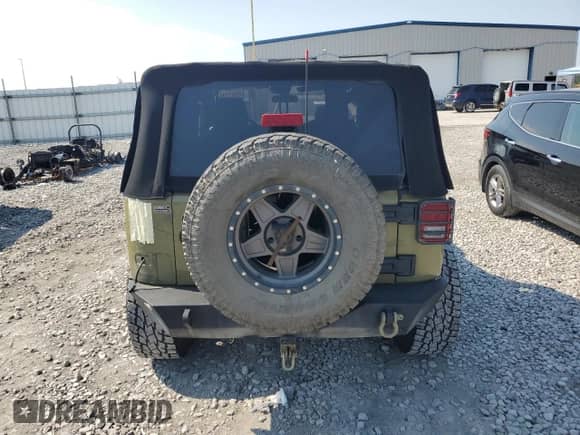 2013 Jeep Wrangler Rubicon with VIN 1C4HJWCG0DL566479, listed as a Copart auction lot 69092745 with 103,839 mi miles and Salvage title. Bid and sale history available at DreamBid. Image 6.