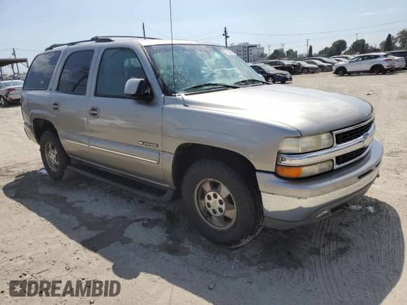 2001 Chevrolet Tahoe LS with VIN 1GNEC13T41R133700, listed as a Copart auction lot 71240535 with 143,051 mi miles and Salvage title. Bid and sale history available at DreamBid. Image 4.
