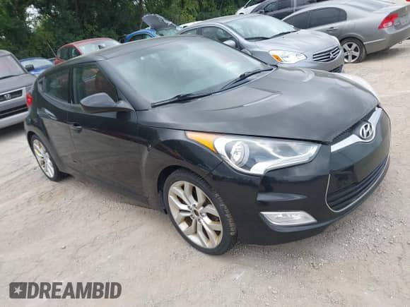 2012 Hyundai Veloster w/Red Int z VIN KMHTC6AD2CU076787, wystawiony jako IAAI lot #43056506 z przebiegiem 143 077 mil mil oraz . Historia ofert i sprzedaży dostępna na DreamBid. Obrazek 1.