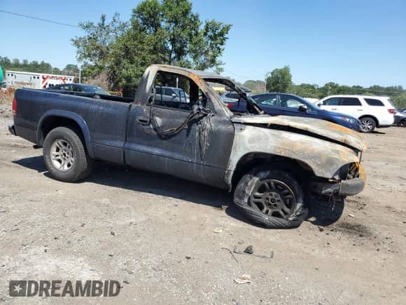2003 Dodge Dakota с VIN 1D7FL16X13S115717, выставлен на аукционе Copart как лот 70060925 с пробегом Не указан миль и Списание • Salvage title. История ставок и продаж доступна на DreamBid. Изображение 4.
