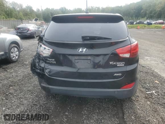 2012 Hyundai Tucson GLS with VIN KM8JUCAC8CU542913, listed as a Copart auction lot 70823765 with 124,426 mi miles and Salvage title. Bid and sale history available at DreamBid. Image 6.