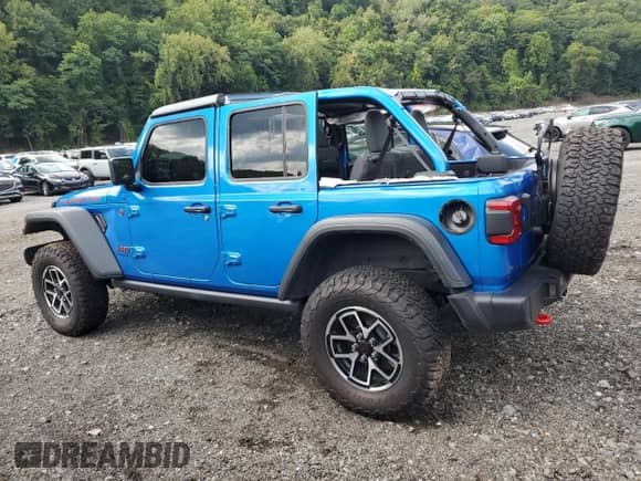 2024 Jeep Wrangler Rubicon z VIN 1C4PJXFG3RW369521, wystawiony jako Copart lot #71998475 z przebiegiem 2 499 mil mil oraz Szkoda całkowita • Salvage title. Historia ofert i sprzedaży dostępna na DreamBid. Obrazek 2.