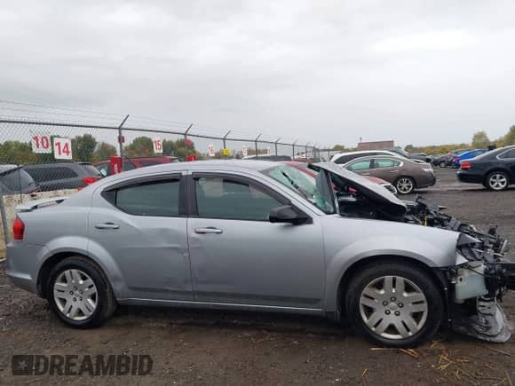 2013 Dodge Avenger SE with VIN 1C3CDZAB5DN771735, listed as a IAAI auction lot 43395877 with 87,931 mi miles and . Bid and sale history available at DreamBid. Image 14.
