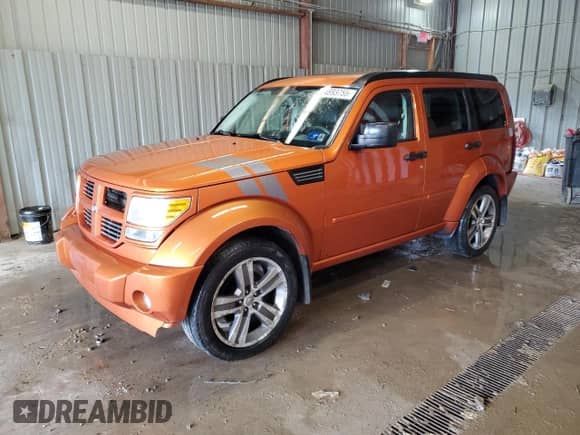 2011 Dodge Nitro Shock z VIN 1D4PU7GX8BW590952, wystawiony jako Copart lot #64893755 z przebiegiem 135 449 mil mil oraz Szkoda całkowita • Salvage title. Historia ofert i sprzedaży dostępna na DreamBid. Obrazek 1.