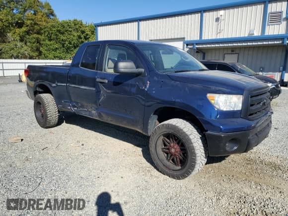 2013 Toyota Tundra with VIN 5TFRM5F13DX059694, listed as a Copart auction lot 82513565 with 122,344 mi miles and Salvage title. Bid and sale history available at DreamBid. Image 4.