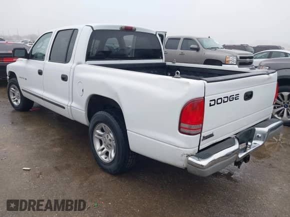 2002 Dodge Dakota SLT with VIN 1B7HL48N72S505915, listed as a IAAI auction lot 41451568 with 220,716 mi miles and . Bid and sale history available at DreamBid. Image 3.