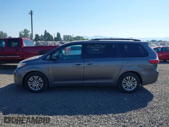 2016 Toyota Sienna XLE with VIN 5TDYK3DC8GS701587, listed as a IAAI auction lot 42444516 with 215,684 mi miles and . Bid and sale history available at DreamBid. Image 14.