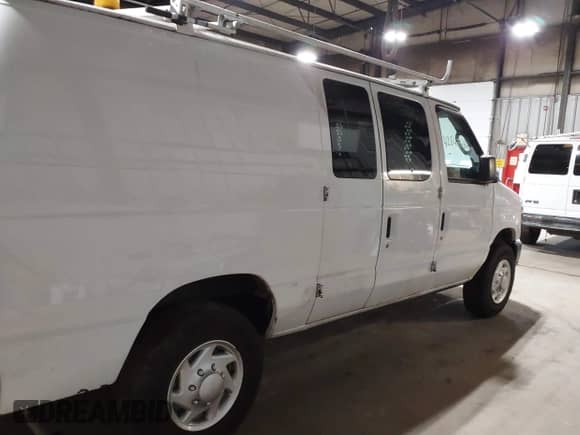 2014 Ford Econoline Cargo Commercial with VIN 1FTNE2EL6EDB13764, listed as a IAAI auction lot 42647684 with 99,876 mi miles and . Bid and sale history available at DreamBid. Image 13.