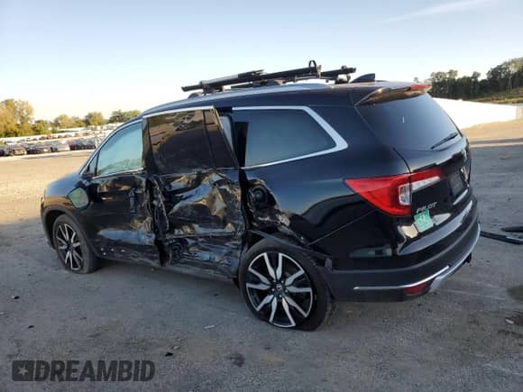 2021 Honda Pilot Elite с VIN 5FNYF6H09MB020943, выставлен на аукционе Copart как лот 81868105 с пробегом 73 095 миль миль и На запчасти • Non repairable. История ставок и продаж доступна на DreamBid. Изображение 2.