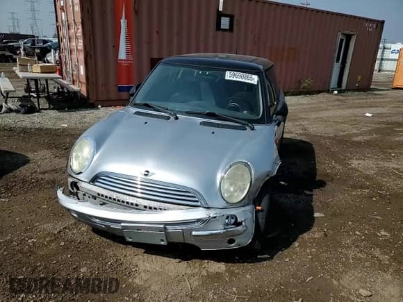 2004 MINI Hardtop with VIN WMWRC33454TJ56308, listed as a Copart auction lot 59690865 with 99,374 mi miles and Salvage title. Bid and sale history available at DreamBid. Image 13.