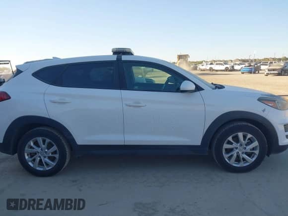 2019 Hyundai Tucson SE with VIN KM8J23A42KU031324, listed as a IAAI auction lot 43559076 with 124,556 mi miles and . Bid and sale history available at DreamBid. Image 13.