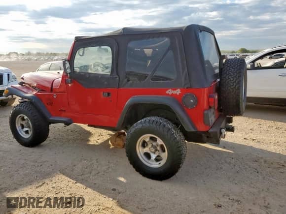 2000 Jeep Wrangler SE with VIN 1J4FA29P4YP798115, listed as a Copart auction lot 80751605 with 119,345 mi miles and Salvage title. Bid and sale history available at DreamBid. Image 2.