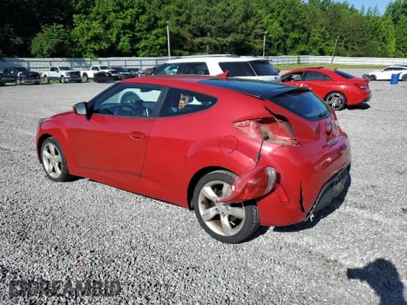 2013 Hyundai Veloster w/Black Int z VIN KMHTC6AD2DU126699, wystawiony jako Copart lot #57329805 z przebiegiem 85 303 mil mil oraz Szkoda całkowita • Salvage title. Historia ofert i sprzedaży dostępna na DreamBid. Obrazek 2.