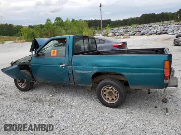 1995 Nissan Frontier z VIN 1N6SD11S4SC459520, wystawiony jako Copart lot #62758145 z przebiegiem Nie podano mil oraz Nie do naprawy • Non repairable. Historia ofert i sprzedaży dostępna na DreamBid. Obrazek 2.