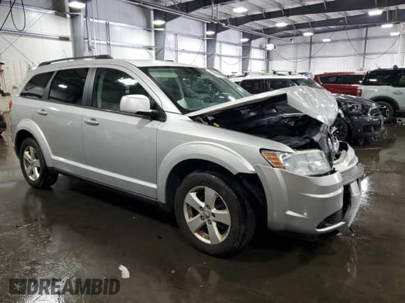 2010 Dodge Journey SXT with VIN 3D4PG5FV6AT190999, listed as a Copart auction lot 69599345 with 127,601 mi miles and Salvage title. Bid and sale history available at DreamBid. Image 4.