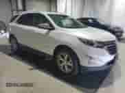 2018 Chevrolet Equinox Premier z VIN 2GNAXVEV6J6164385, wystawiony jako Copart lot #80213225 z przebiegiem 82 081 mil mil oraz Czysty tytuł • Clean title. Historia ofert i sprzedaży dostępna na DreamBid. Obrazek 4.