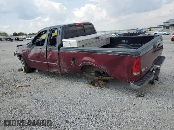 2003 Ford F-150 XL with VIN 1FTRX18L23NB11079, listed as a Copart auction lot 80260145 with 167,209 mi miles and Salvage title. Bid and sale history available at DreamBid. Image 2.