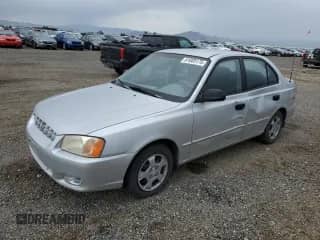 2000 Hyundai Accent z VIN KMHCG45G8YU120795, wystawiony jako Copart lot #61005175 z przebiegiem 96 515 mil mil oraz Czysty tytuł • Clean title. Historia ofert i sprzedaży dostępna na DreamBid. Obrazek 1.