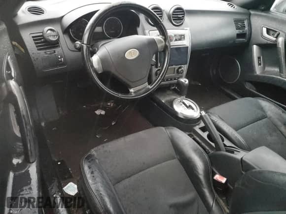 2008 Hyundai Tiburon GT с VIN KMHHN66F68U272717, выставлен на аукционе Copart как лот 83004014 с пробегом Не указан миль и Списание • Salvage title. История ставок и продаж доступна на DreamBid. Изображение 8.