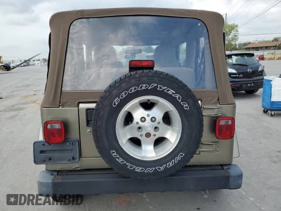 2003 Jeep Wrangler Sahara с VIN 1J4FA59S13P312830, выставлен на аукционе Copart как лот 52730955 с пробегом 99 247 миль миль и Списание • Salvage title. История ставок и продаж доступна на DreamBid. Изображение 6.