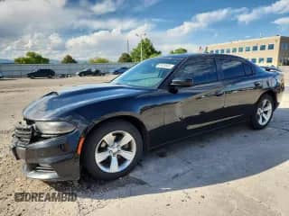 2015 Dodge Charger SXT with VIN 2C3CDXHG5FH765001, listed as a Copart auction lot 80828655 with 153,267 mi miles and Salvage title. Bid and sale history available at DreamBid. Image 1.